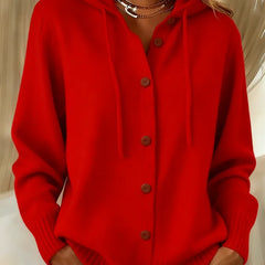 Woman wearing a soft button-front cardigan hoodie with drawstring hood and ribbed cuffs