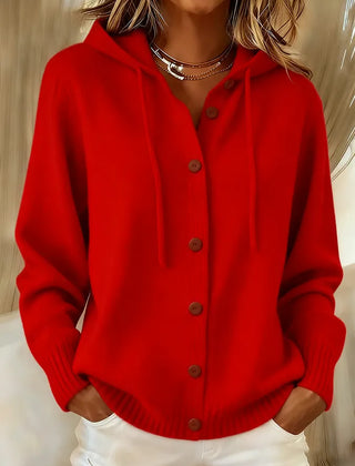Woman wearing a soft button-front cardigan hoodie with drawstring hood and ribbed cuffs