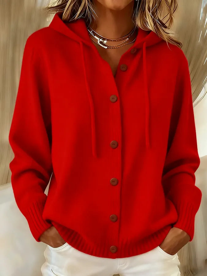 Woman wearing a soft hooded button-up cardigan with drawstring hood and ribbed cuffs