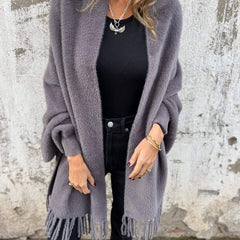 Women's long fringed knit cardigan with plush texture and draping silhouette