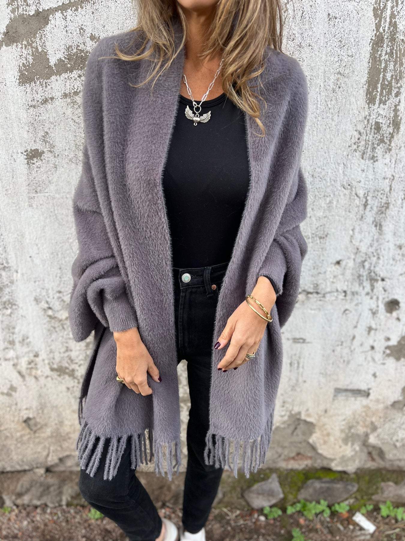 Women's long fringed knit cardigan with plush texture and draping silhouette