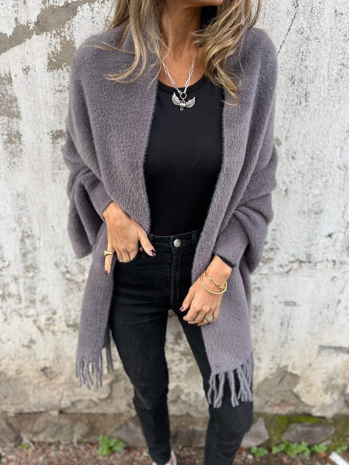 Women's long fringed knit cardigan with plush texture and draping silhouette