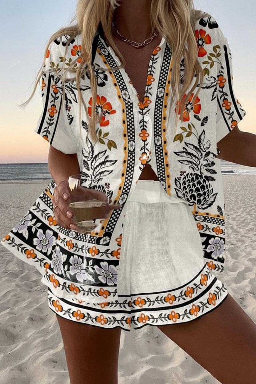 White two-piece summer set with folk-inspired pineapple and floral print, button-up shirt and shorts