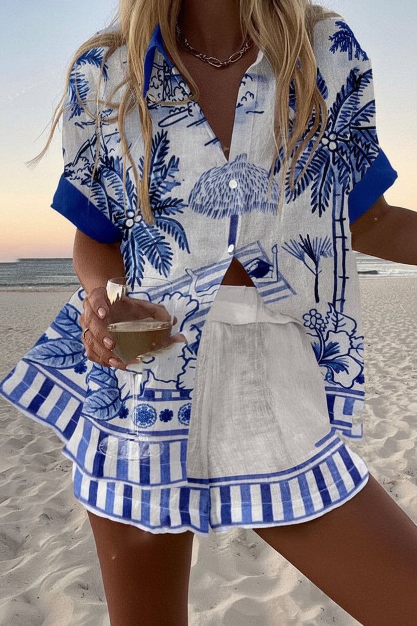 Women's white summer coordinated set with blue tropical print button-up shirt and striped-hem shorts
