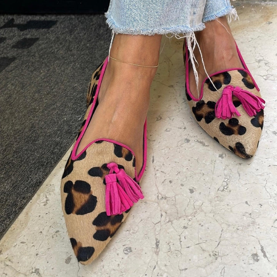 Leopard print ballet flats with tassel detailing and contrasting trim