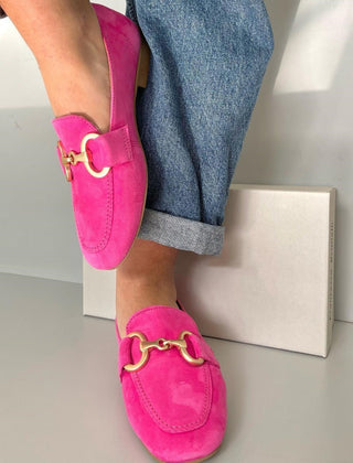 Pink loafers with a gold detail, styled for casual-chic everyday wear