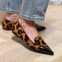 Animal print ballet flats with a glossy contrasting black toe