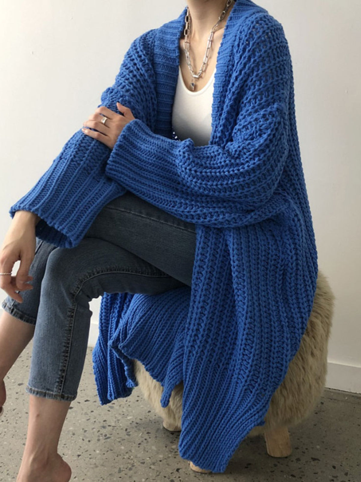 Blue oversized open-front split knit cardigan with a relaxed drape