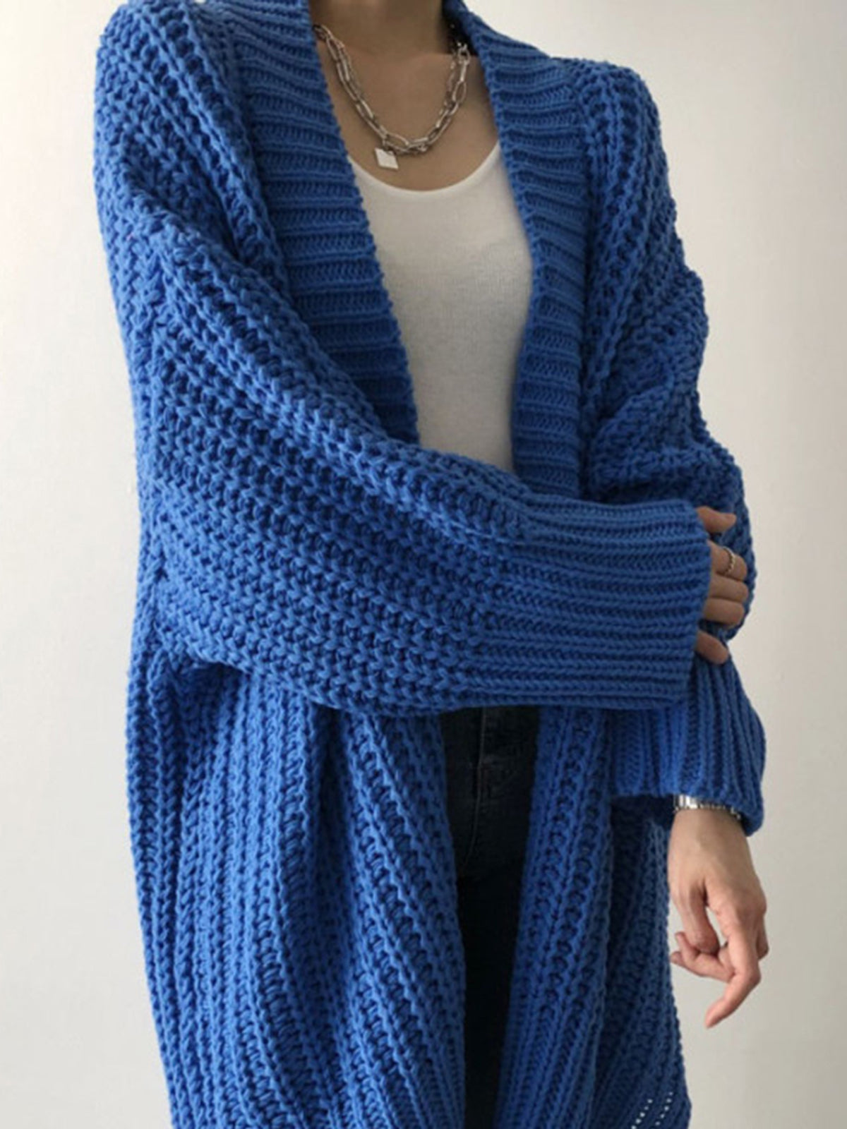 Blue oversized open-front split knit cardigan with a relaxed drape