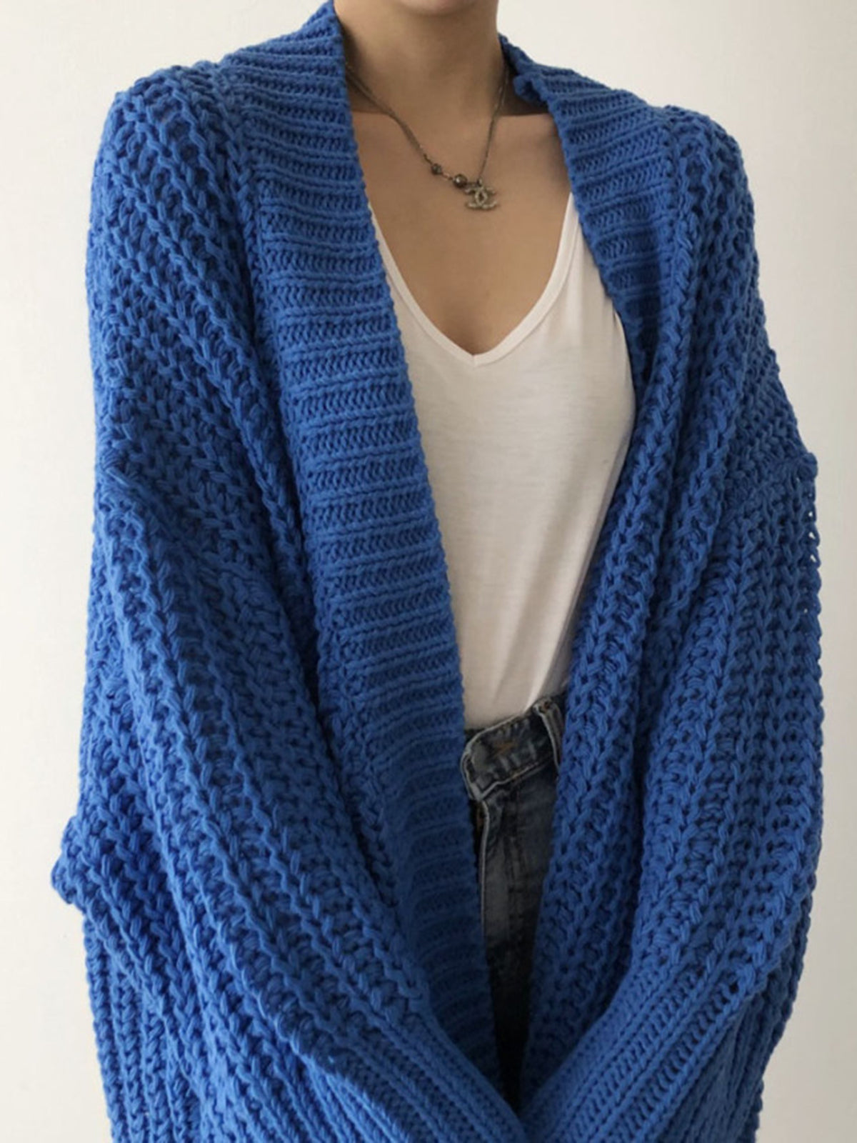 Blue oversized open-front split knit cardigan with a relaxed drape