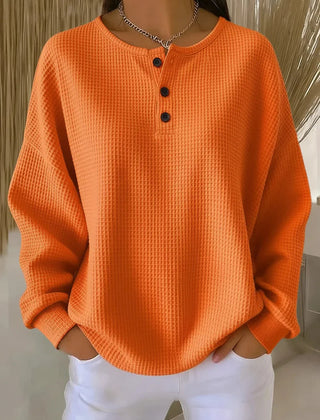 Waffle-knit henley collar sweatshirt with button placket in a relaxed fit