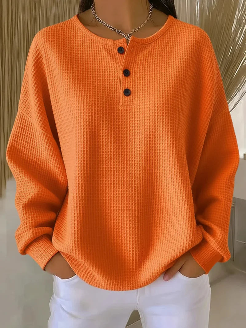 Waffle-knit henley collar sweatshirt with button placket in a relaxed fit