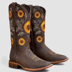 Sunflower-embroidered western boots with pointed toe and stacked block heel in warm brown