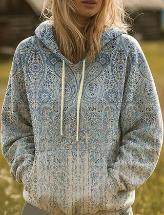 Multicolor rainbow sunburst graphic hoodie with hood and ribbed cuffs in a relaxed fit