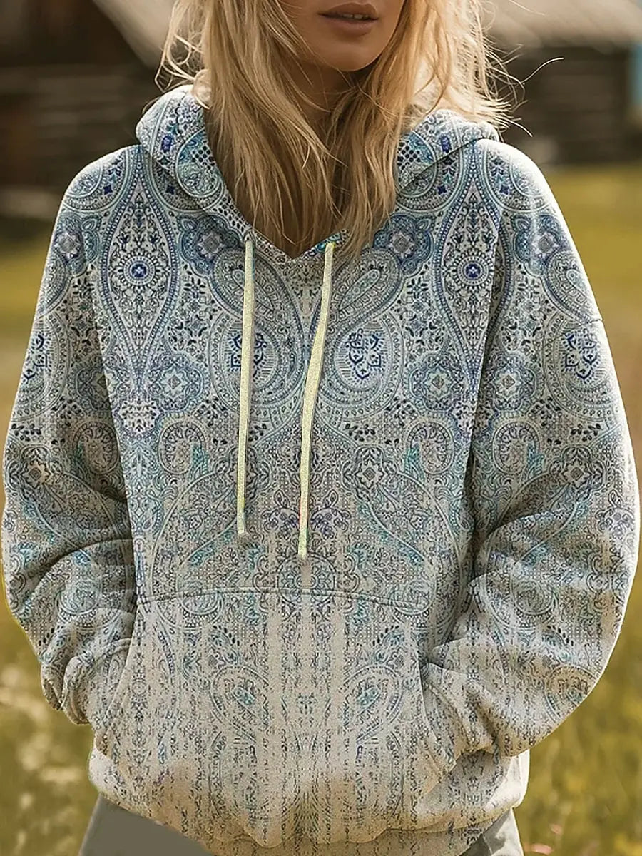 Multicolor rainbow sunburst graphic hoodie with hood and ribbed cuffs in a relaxed fit