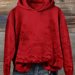 Women's floral eyelet pullover hoodie with structured hood and scalloped hem