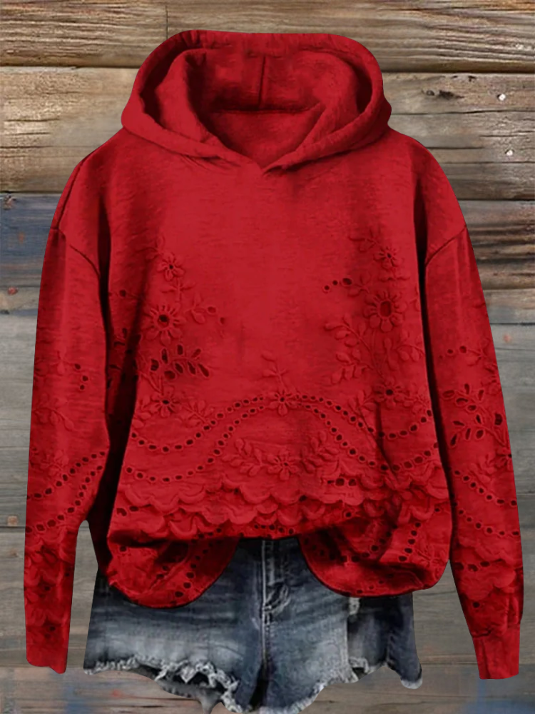 Women's floral eyelet pullover hoodie with structured hood and scalloped hem