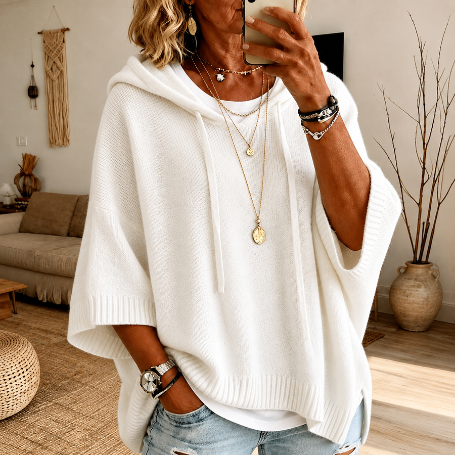 White hooded poncho sweater with drawcord hood and ribbed finishes in a relaxed cut