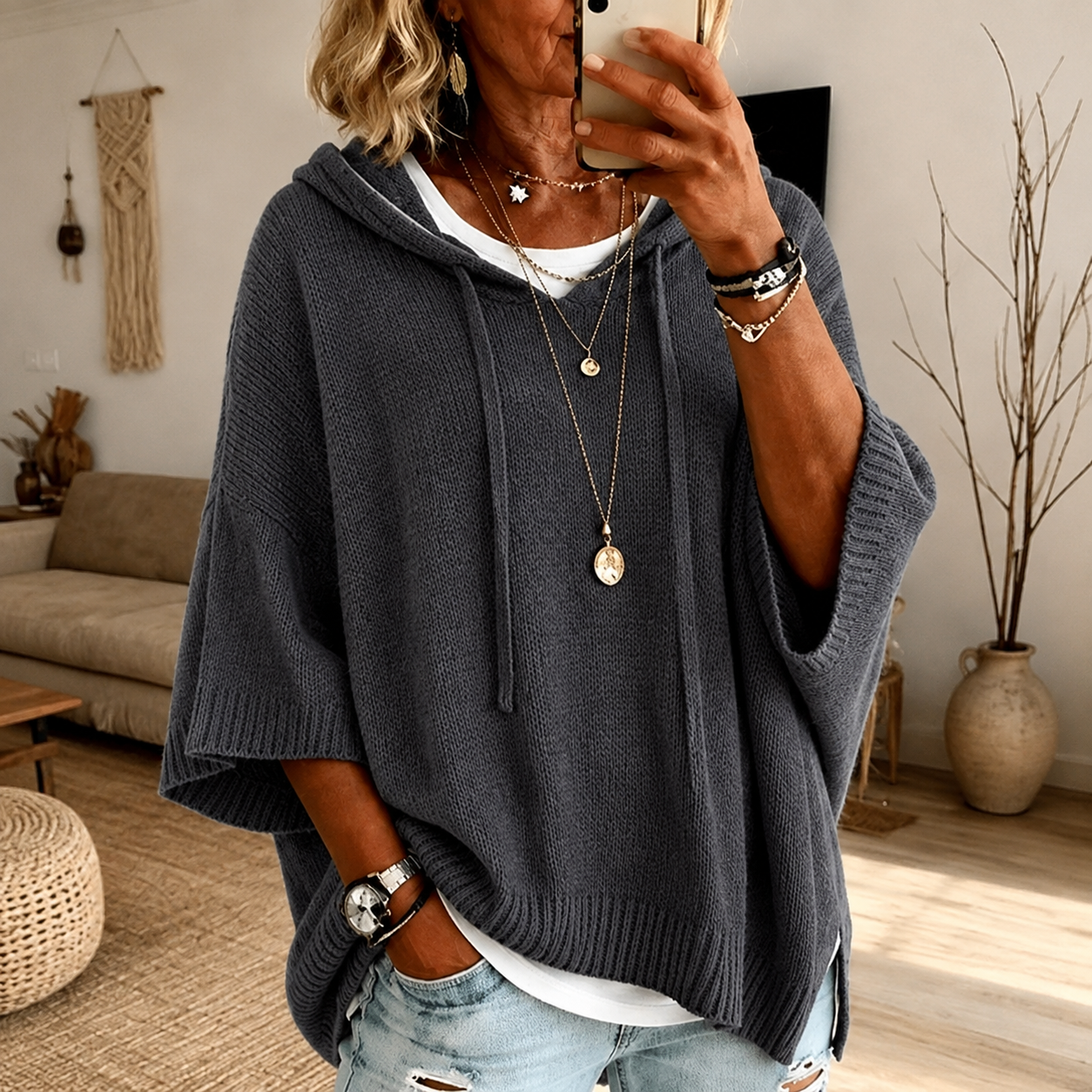 Anthracite grey hooded poncho sweater with drawstring hood and ribbed knit finish