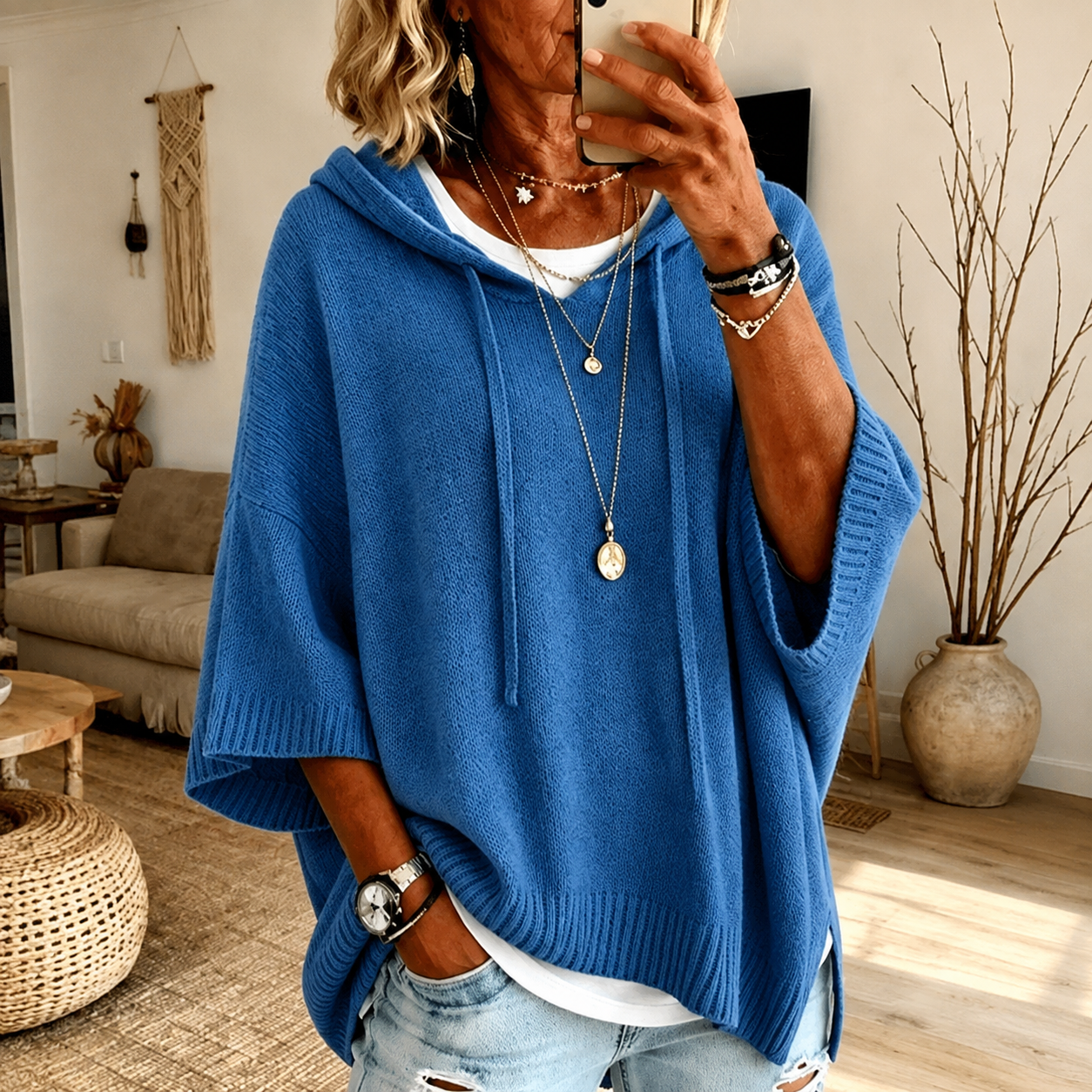 Blue hooded poncho sweater with drawcord hood and ribbed finishes, relaxed loose fit