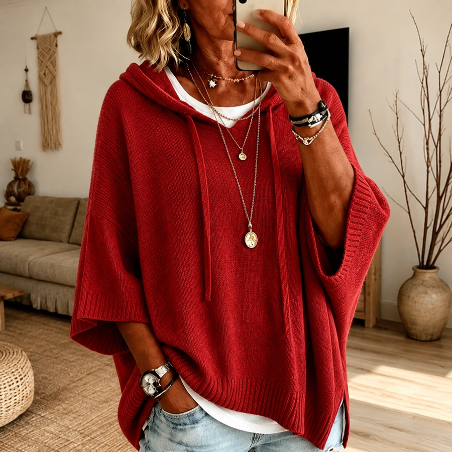Red hooded poncho sweater with drawstrings and ribbed finish, loose relaxed fit