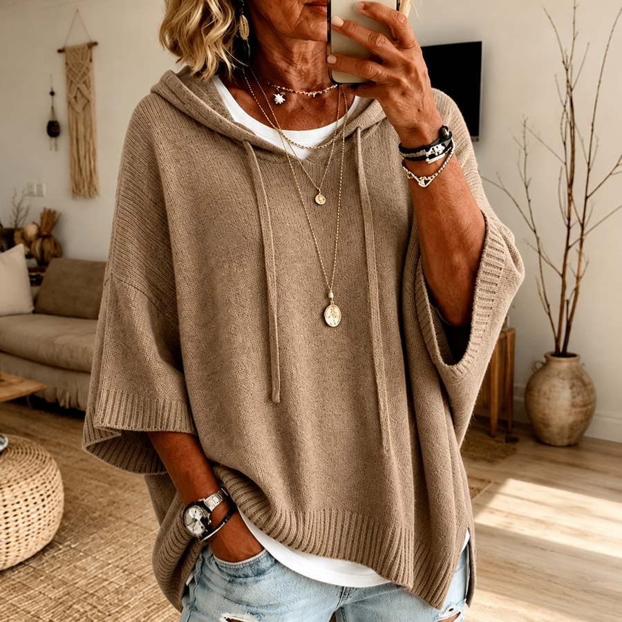Taupe hooded poncho sweater with a loose knit and drawstring hood