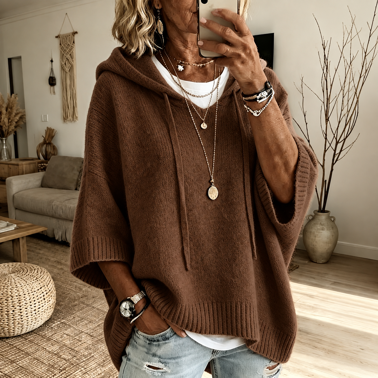 Brown hooded poncho sweater in a relaxed knit with drawcord hood and ribbed finishes