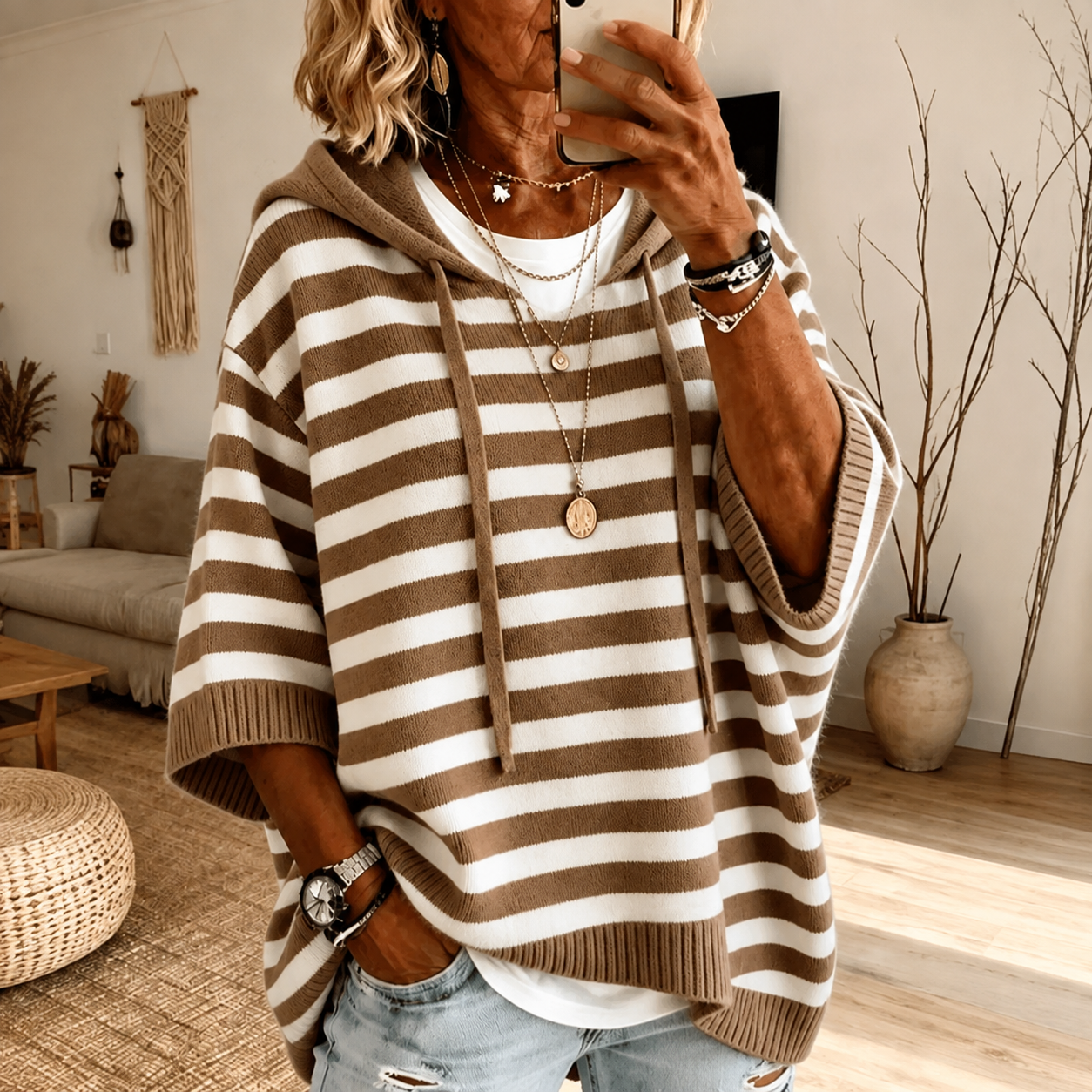 Taupe striped hooded poncho sweater with drawstring hood and relaxed knit fit