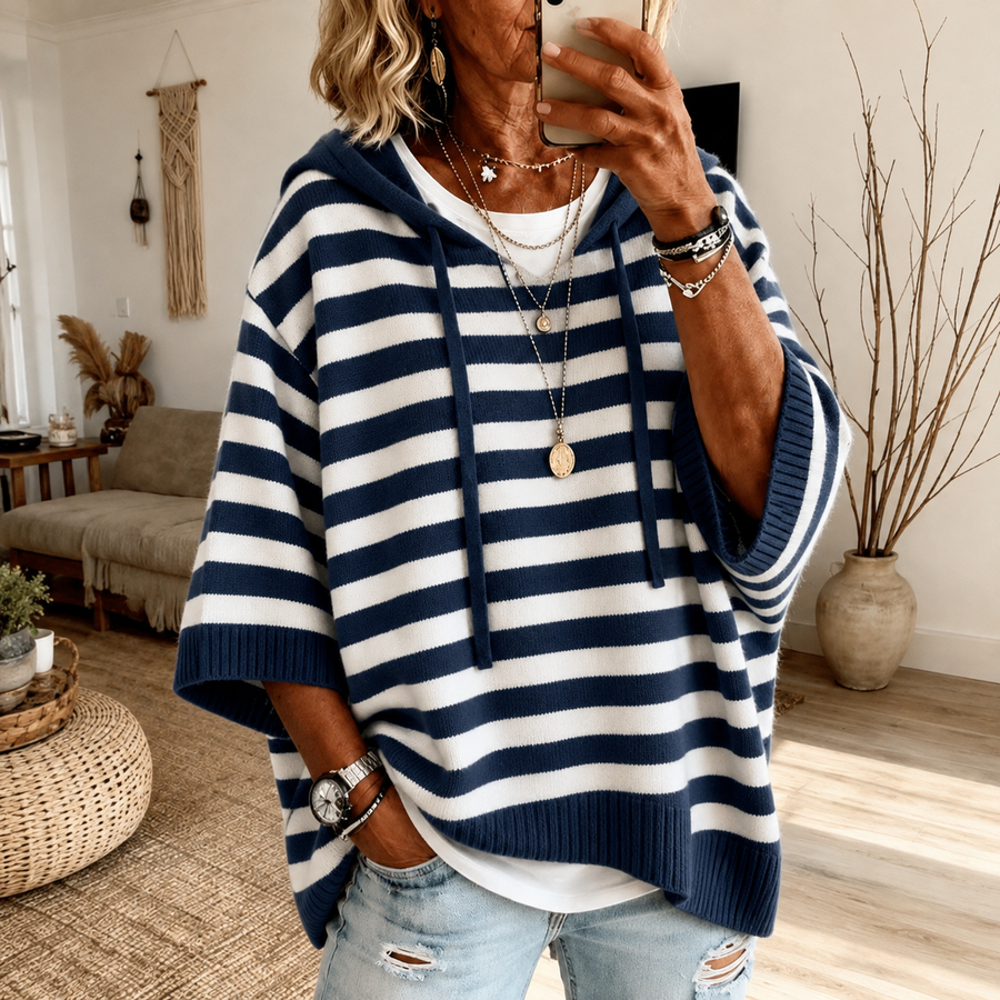 Navy blue striped hooded poncho sweater with drawcord hood and ribbed finishes