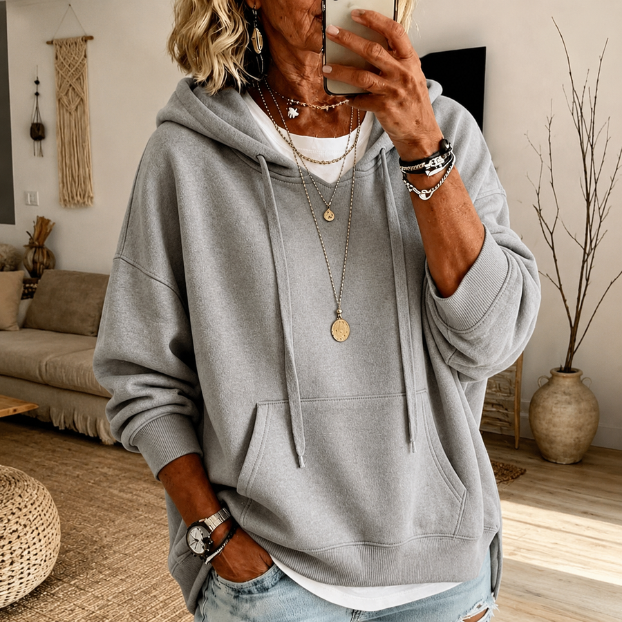 Light grey oversized hooded sweater with drawstring hood, kangaroo pocket and ribbed trims