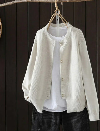 Women's V-neck button front cardigan with ribbed cuffs and hem in a solid shade