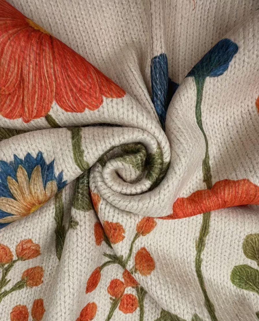 Oatmeal zip cardigan with wildflower meadow print, gold zipper, ribbed collar and cuffs