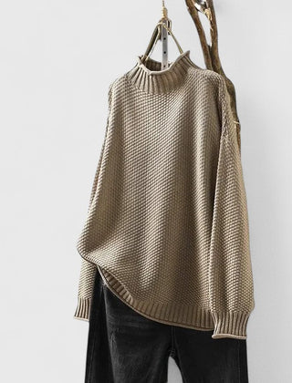 Women's textured knit mock neck sweater with ribbed cuffs and relaxed fit