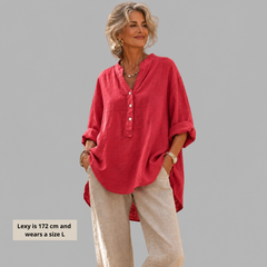 Woman wearing a relaxed cotton-linen V-neck blouse with soft draping