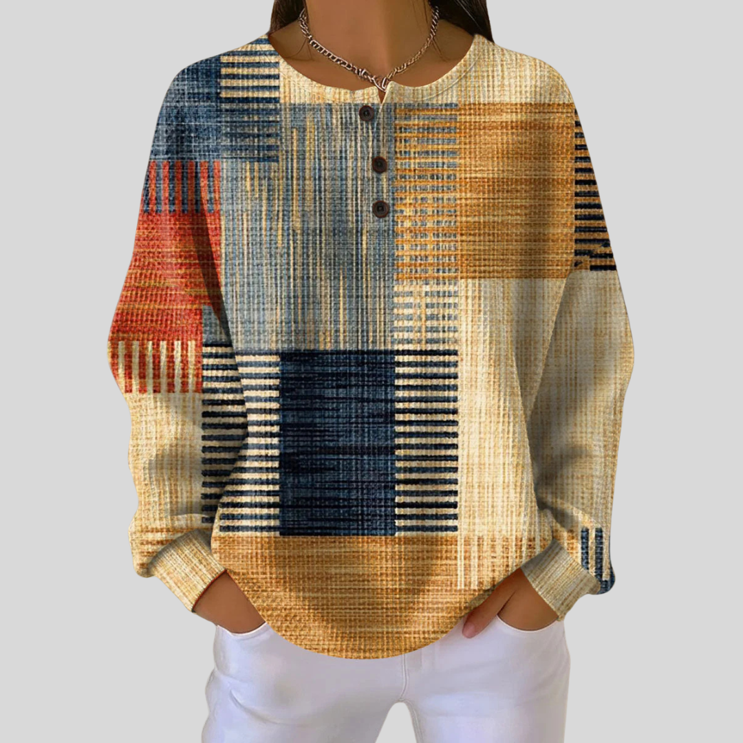 Waffle-knit patchwork sweatshirt in amber, navy and coral with a button neckline