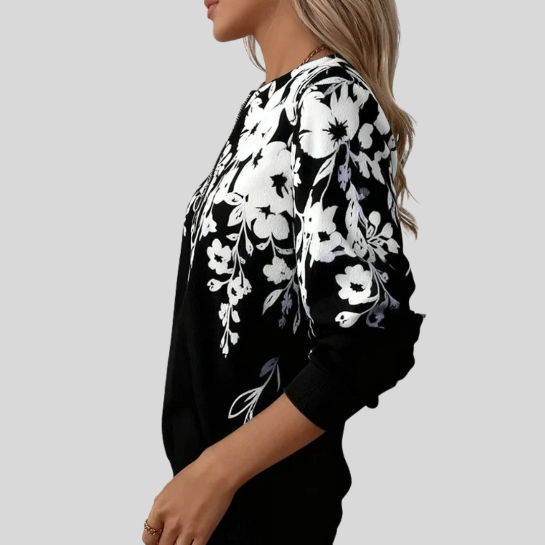 Black-and-white floral print quarter-zip sweatshirt with ring-pull zip and ribbed cuffs