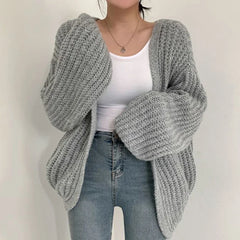 Oversized chunky knit cardigan with lantern sleeves and slouchy open-front silhouette