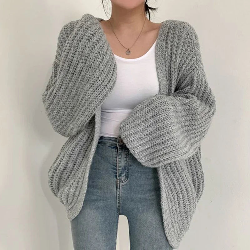 Oversized chunky knit cardigan with lantern sleeves and slouchy open-front silhouette
