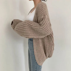 Oversized chunky knit cardigan with lantern sleeves and slouchy open-front silhouette