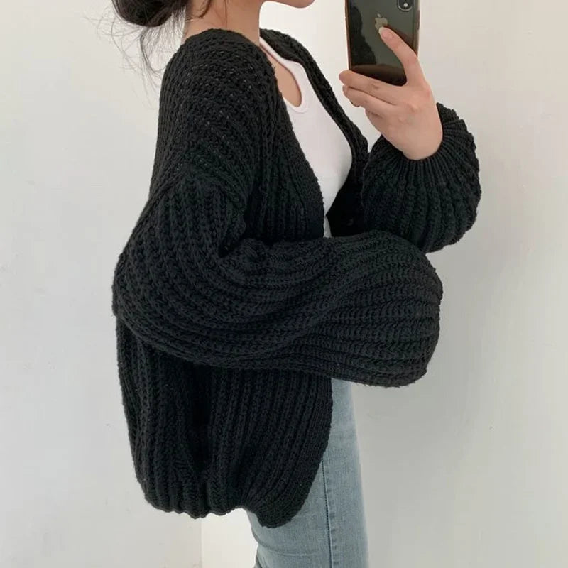 Oversized chunky knit cardigan with lantern sleeves and slouchy open-front silhouette
