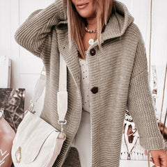 Women's hooded oversized chunky knit cardigan with large buttons in a soft neutral shade