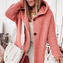 Women's hooded oversized chunky knit cardigan with large buttons in a soft neutral shade