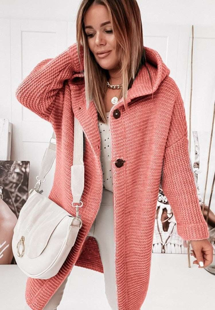 Women's hooded oversized chunky knit cardigan with large buttons in a soft neutral shade