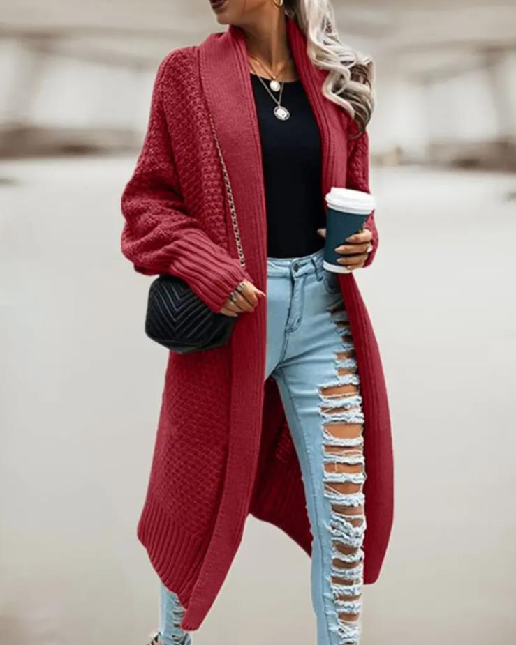 Women's hooded oversized chunky knit cardigan with large buttons in a soft neutral shade