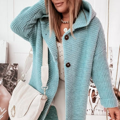 Women's hooded oversized chunky knit cardigan with large buttons in a soft neutral shade