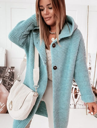 Women's hooded oversized chunky knit cardigan with large buttons in a soft neutral shade