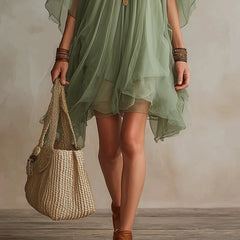 Green layered boho mini dress with tiered floaty silhouette and relaxed fit