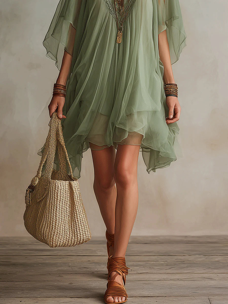 Green layered boho mini dress with tiered floaty silhouette and relaxed fit