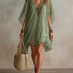 Green layered boho mini dress with tiered floaty silhouette and relaxed fit