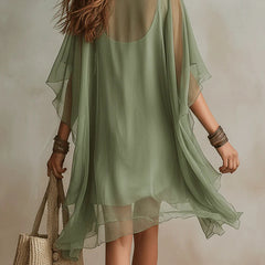 Green layered boho mini dress with tiered floaty silhouette and relaxed fit